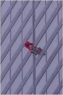 "Spider Dan" Goodwin climging the Sears Tower facade in his Spiderman suit